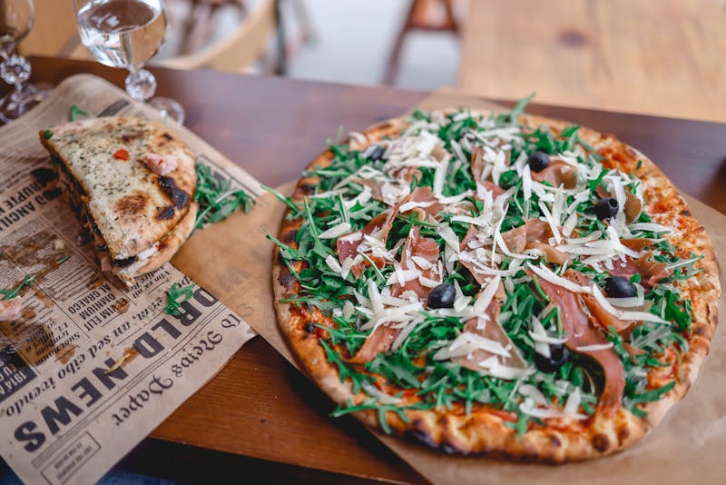 Prosciutto e Rucola specialty pizza with fresh arugula