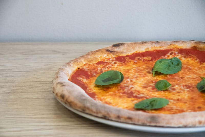 Classic Margherita pizza with fresh basil and mozzarella