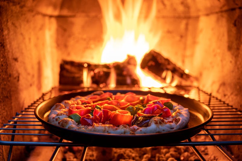 Freshly baked wood-fired pizza with premium toppings